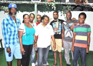 Members of the victorious TNT team celebrate with Georgetown Dominoes Association Secretary, Barbara Marshall who is second from left. 