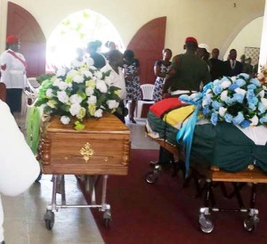 The caskets of Sergeant Robert Pyle and his wife Stacy Pyle at the Golden Grove Seventh Day Adventist Church 