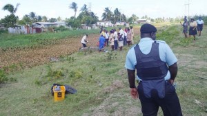 Undertakers removing the body of Akeem Culley yesterday from the canal which separates North Sophia from Liliendaal. 