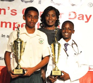 Category winners Shamal Khan (left) and Patrick Thompson with the competition’s coordinator.