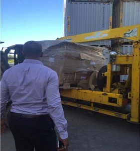 GTTA President, Godfrey Munroe (left) ensure the equipment safely leaves the wharf.