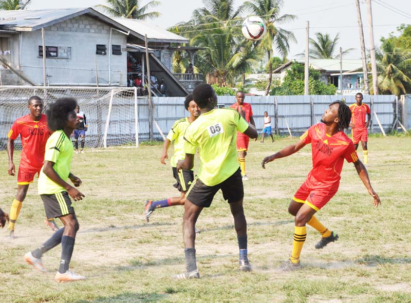 Action in the STAG EBFA Senior League match between Grove Hi Tech (yellow & black) and Soesdyke Falcons