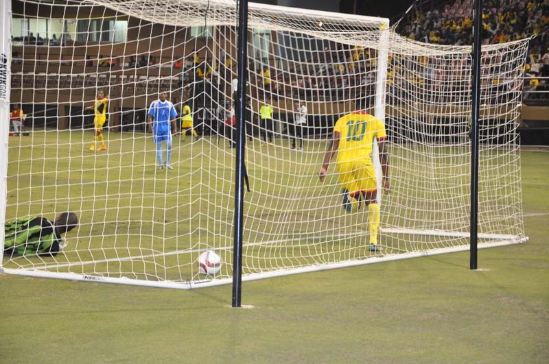 Marcel Barrington #10, is about to celebrate Guyana’s sixth goal. Anguilla’s GK Kasem Thompson is floored at left.