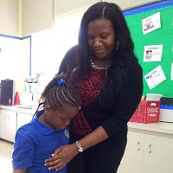 Tamara Butler - red and black top daughter in blue polo shirt.