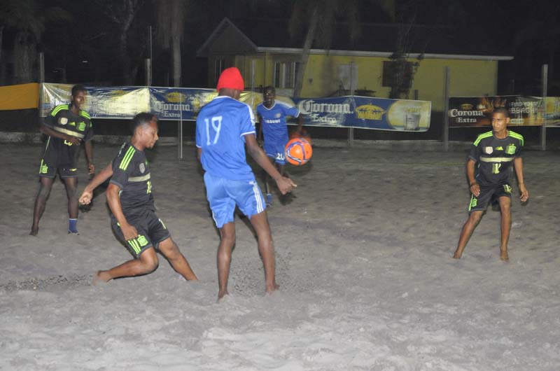 This Silver Bullets player seeks to control the ball before passing to his teammate in their match against Hi Stars at the Kuru Kururu Beach Soccer ground.