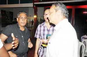  Mr. Roy Beepat (left) and Peter Abdool (right) involved in discussion at last Saturday’s appreciation evening at Giftland Mall.