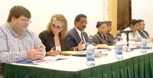  Minister of Legal Affairs, Basil Williams (third from left) with US Charge d’Affaires, Bryan Hunt (left) and IDB Country Representative, Sophie Makonnen, and others at the forum.