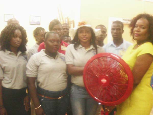 Businesswoman Simone Hodge makes the presentation to the Linden Hospital Complex staffers