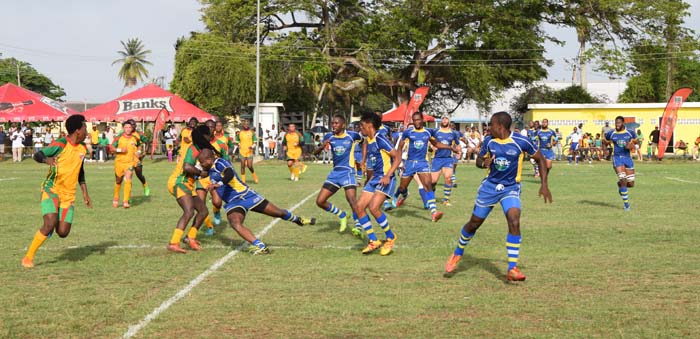 Green Machine Ronald Mayers (with ball) seen during an offensive drive against Barbados yesterday at the National Park.