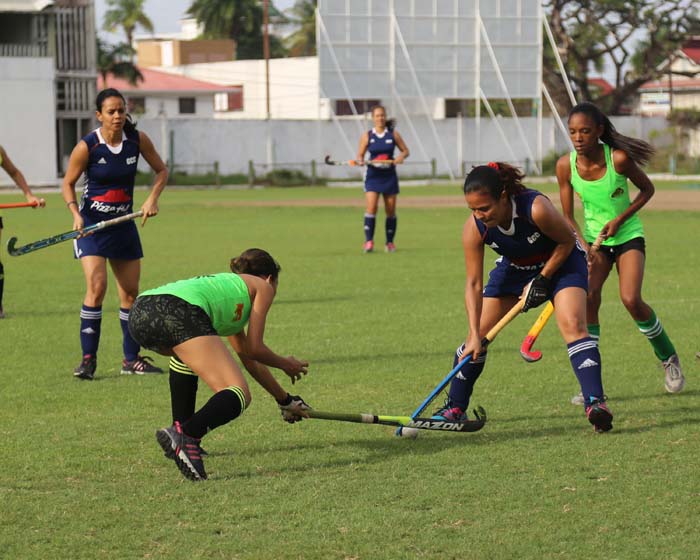 Pizz Hut GCC Kerensa Fernandes (Blue uniform) battles for possession against Hikers Latacia Chung during their clash recently.