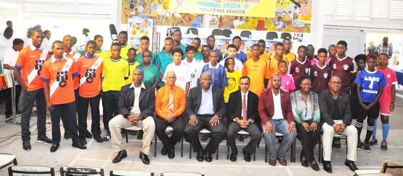 The GFF Executive Committee take time out for a photo op with players from various clubs that will be participating in the historic Thunderbolt Flour Power National Under-17 League that was unveiled yesterday.