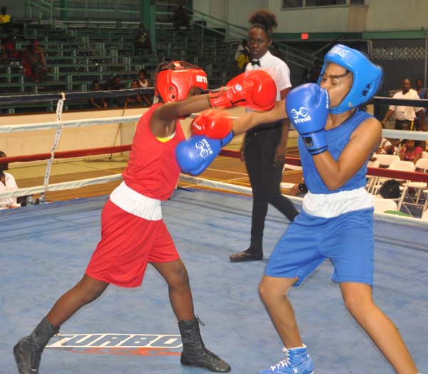 Rianna Rogers (right) exchange punches with Rondesa Bagot during their contest which Rogers won. 