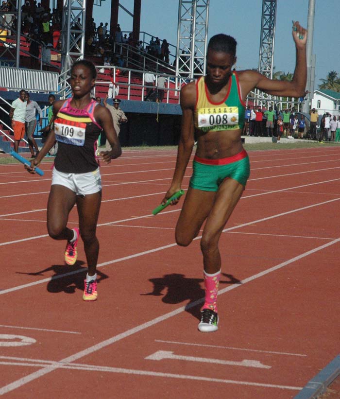 Flashback! GDF’s Natricia Hooper (right) gets home just ahead of Police’s Jevina Sampson last year in the 4x400m relay at Joint Services.