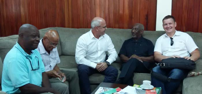 Minister in the Social Protection Ministry, Keith Scott (second from right) and Igor Tolpykin (extreme right) sharing a moment with other representatives of BCGI yesterday.