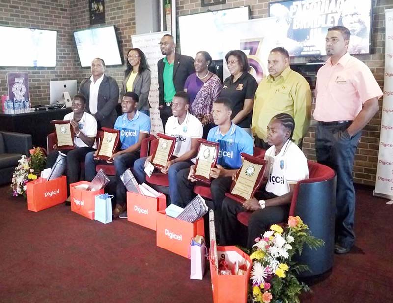 The five Guyanese West Indies players with Sports Minister, Director of Sports, NSC Chairman, Minister of Tourism, Head of Digicel Marking and GCB President at 704 Sports Bar & Lounge yesterday.