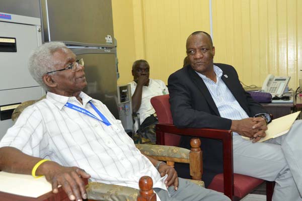 Joseph Harmon (r) meeting with SARU’s Head, Professor Clive Thomas and other officials on Monday.