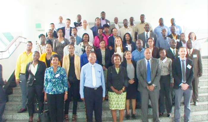 Minister of Natural Resources, Raphael Trotman (third from right, front row) with the participants in a group photo (GINA photo)