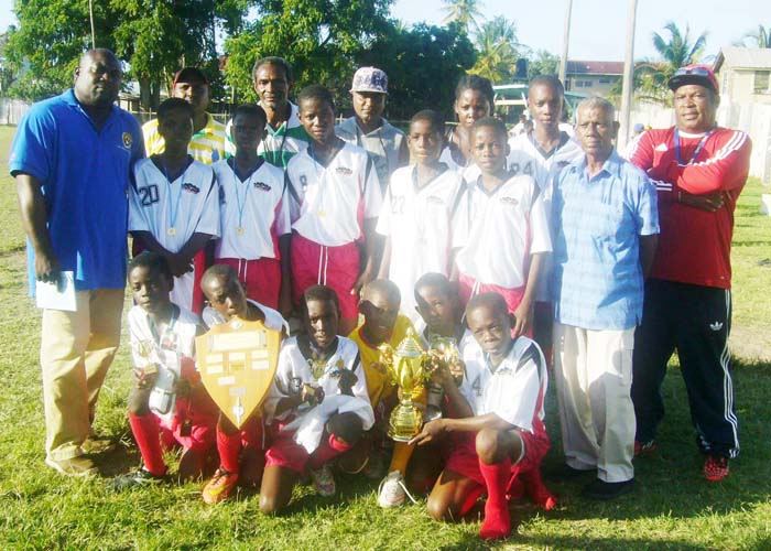 The winners BEI Champion team pose with, donor Isaac Daniel (2nd right) and coordinators Neil Humphrey (right) and Kenrick Bowry. 