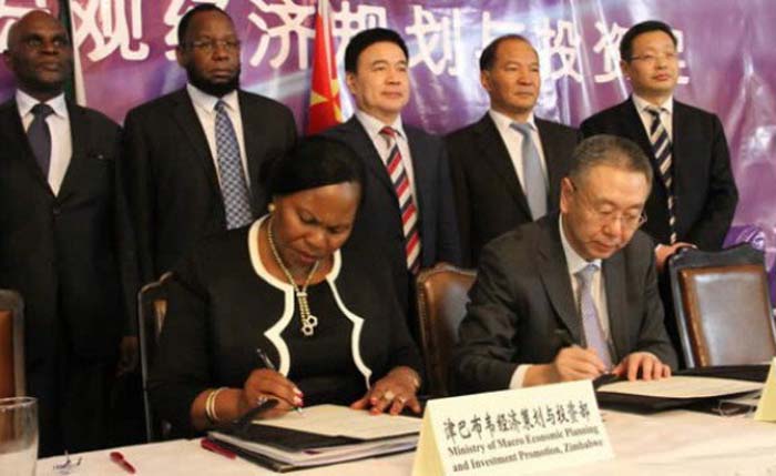 Zimbabwe and China representatives signing the agreement (allafrica.com file photo).