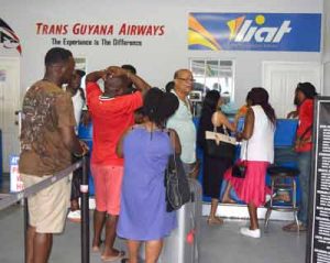 Some frustrated passengers at the LIAT Office, Eugene F. Correia International Airport. 