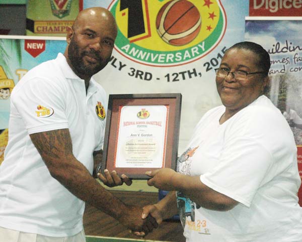 Lugard Mohan (left) presents an award to Ann Gordon, the pair will bring a lot of experience to the coaching staff.