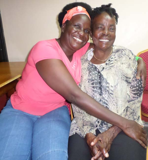  Glowing mother and daughter. Bernice Bobb (left) and her mother Carmen Bobb, share a hug.