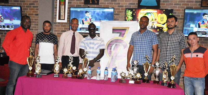 Stakeholders take a photo opportunity during the Golden Mile Road Race launch yesterday at 704 Sports Bar and Lounge.