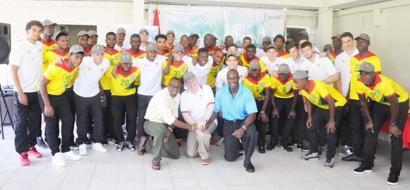 Growing Together! Canadian Ambassador to Guyana His Excellency Pierre Giroux (kneeling center) with GFF President (ag) Bruce Lovell (right) and Director of Sport Christopher Jones take a photo with the Golden Jaguars and Canada’s Men’s U-23 team.