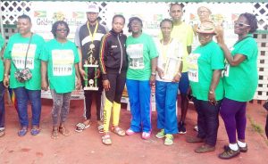 The various winners pose for a photo opportunity with the Jubilee 10k Road Race Organisers yesterday.