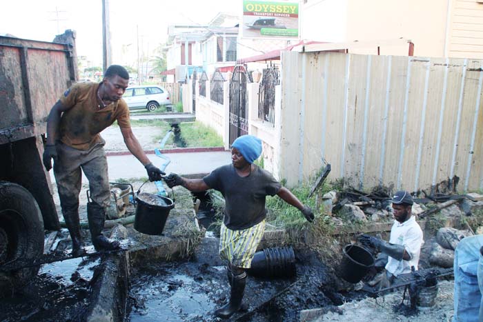 Workers engaged in the cleaning of City drains sometimes refuse equipment.