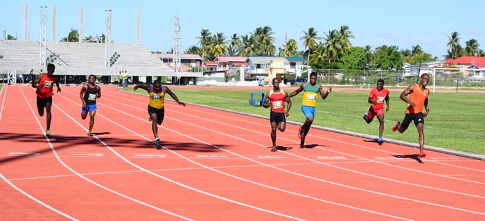 Rupert Perry (right) comfortably takes the 100m Men on Sunday at the National Track and Field Centre, Leonora.