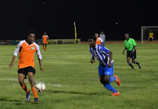 This Fruta Conquerors player (left) in control against GFC on Sunday night at the Leonora Track and Field Facility.