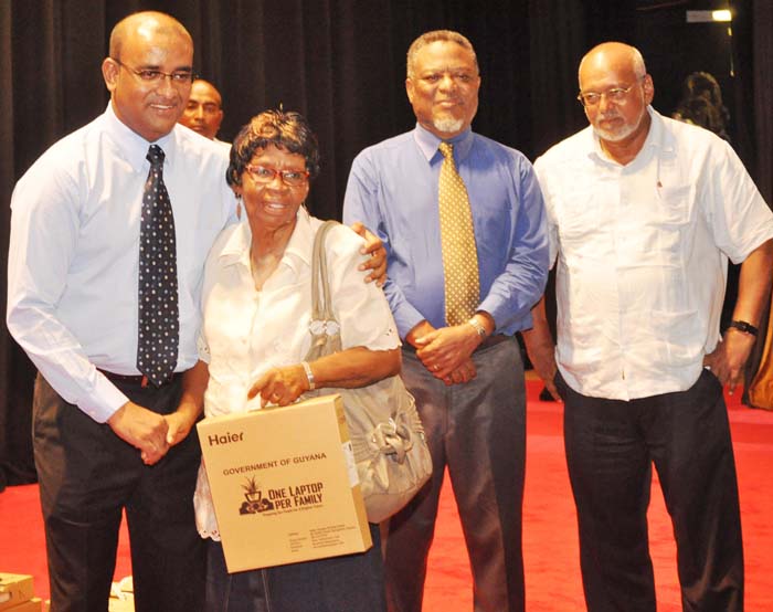 Former President, Bharrat Jagdeo, distributing a laptop in late 2011, shortly before he finished his constitutional two terms in office.