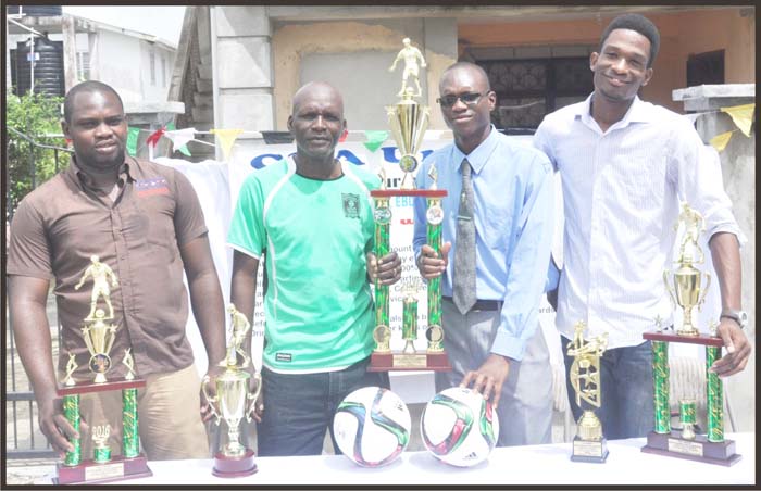 South Quake Youth President Alistair Griffith and Lawrence December of Tucville Street team have one hand on the Trophy. Gospel artist Ryan ‘ DC Speaker’ Patterson (right) and Carlos Griffith founder of C&A Unique share the moment.