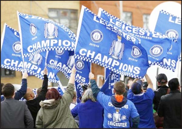 Leicester City fans celebrate with flags. (Action Images via Reuters / Craig BroughLivepic) 