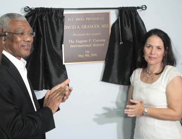 President David Granger and a member of Eugene F. Correia family during the unveiling of the plaque yesterday. 