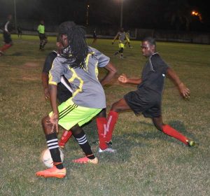 Action in the Riddim Squad (black) and Flamingo match on Tuesday at the GFC ground. Franklin Wilson photo.