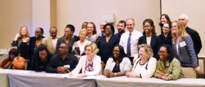 Minister Karen Cummings (seated third from right) during the recent meeting in Florida.