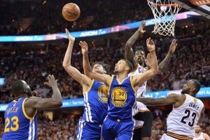 Golden State Warriors guard Stephen Curry (30) and Warriors forward Anderson Varejao (18) reach for the ball in front of Cleveland Cavaliers guard Iman Shumpert (4) and Cavaliers forward LeBron James (23).  (Ken Blaze-USA TODAY Sports)