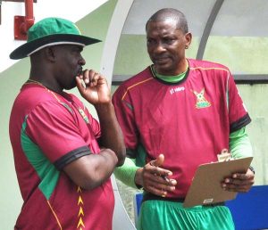 Head Coach Roger Harper talk tactics with his assistant Eusan Crandon at the team’s first session yesterday. 