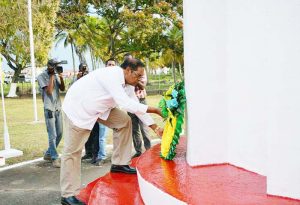 Prime Minister Moses Nagamootoo laying a wreath at the Enmore Martyrs Monument