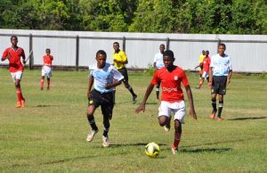 Paradise Invaders (red & white) controlling play in their match with Mahaicony Thunder Hawks.