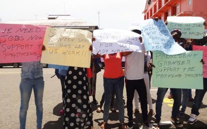 Parking meter contractor hires protestors