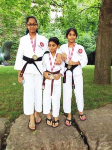 Rebecca, Jonathan and Rachel Ramlal at the World Karate Championships in Toronto, Canada