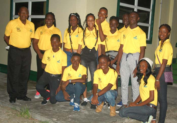 The young band members and their Leader, Rollo Younge, (left) pose for a photograph just before leaving Tiperary Hall, Buxton on Tuesday night.