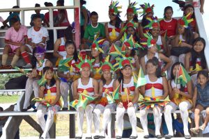 Members of the Waramadong Dance Troupe sit in the stand as they await their entry on to the field to entertain the fans and visitors last Sunday.