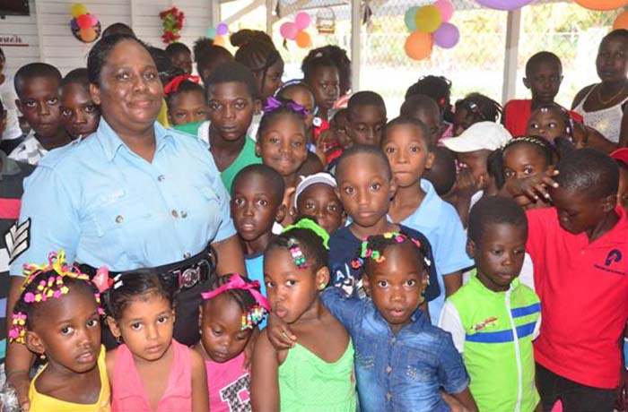 Picture of ASP Fredericks, Officer –in- charge Fort Wellington; Inspector Kelly with children last December.