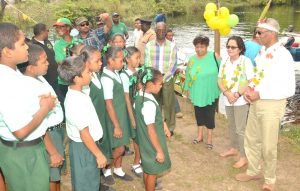 President Granger, First Lady, Mrs. Sandra Granger and Minister of Social Cohesion, Ms. Amna Ally enjoy a performance by the students of the St. Francis Primary School, who welcomed them with a song upon their arrival into the village. 