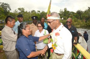 President David Granger is welcomed by Headmistress of the St. Francis Primary School, Moraikobai, Ms. Shalome Calistro, upon his arrival to the village .