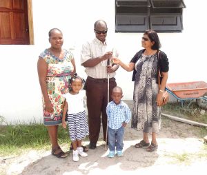 Administrator of the Gafoor Foundation Mrs. Gafoor hands over keys to the house to Oliver Kerr and his family. 